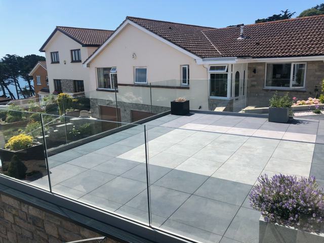 Recent installation of structural beams and modern frameless glass system